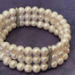 TRIPLE LA PERLE -3 layer fresh water pearl bracelet with elastic strap