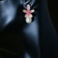 DELIGHTFUL DELILA -Geometric Red and purple Cubic Zirconia in a gold Flower with a Drop Pearl Earring