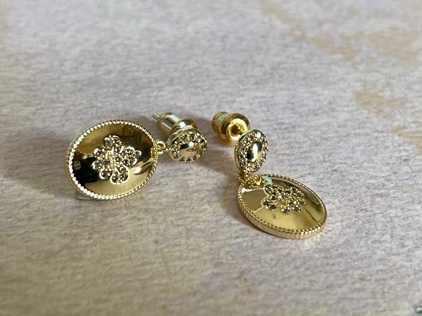 GLORIOUS GLOW  - 18ct real gold plated oval shaped earrings with a zircon fleur- de lis