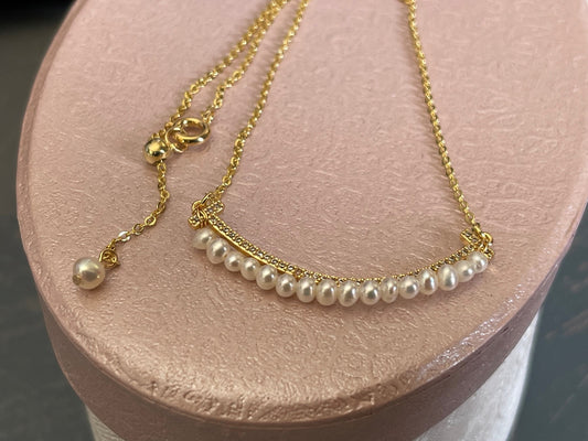 SMILEY FACE Pearl necklace with a tiny row of cubics which is 14 k gold plated