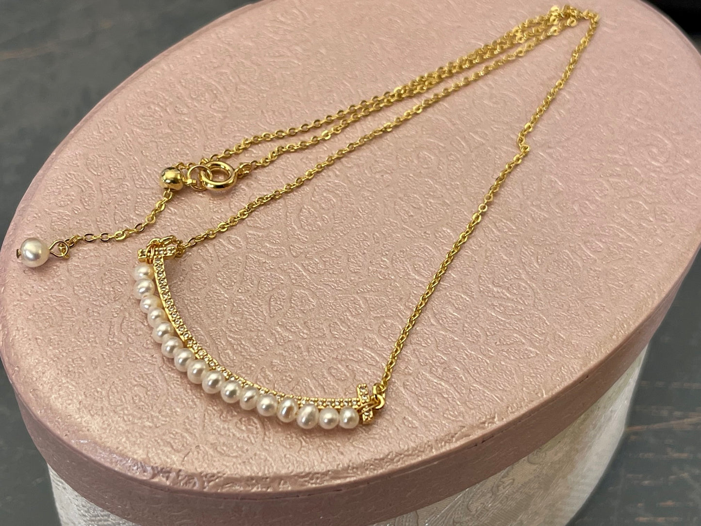 SMILEY FACE Pearl necklace with a tiny row of cubics which is 14 k gold plated