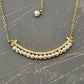 SMILEY FACE Pearl necklace with a tiny row of cubics which is 14 k gold plated