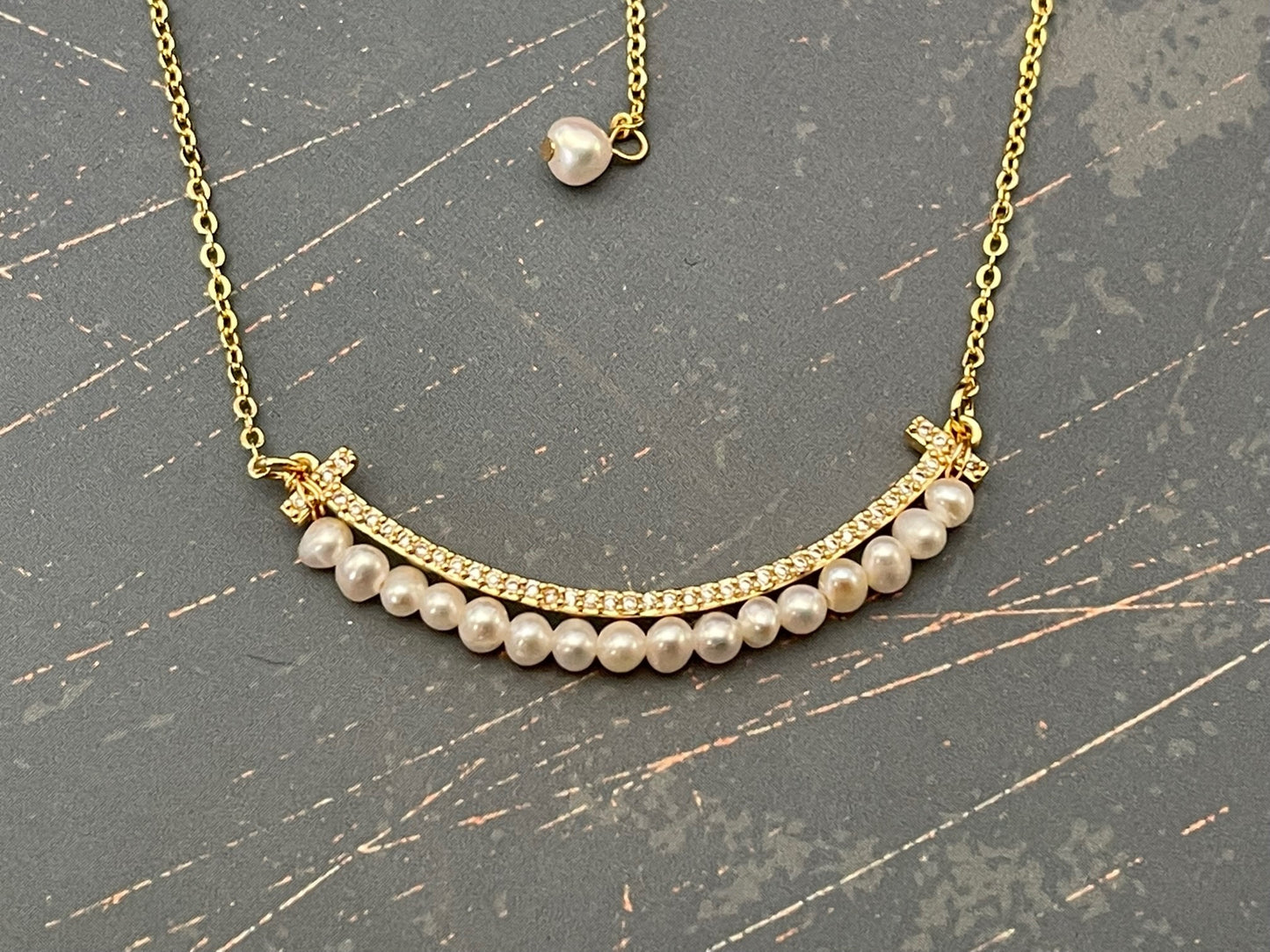 SMILEY FACE Pearl necklace with a tiny row of cubics which is 14 k gold plated